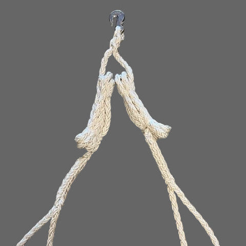 Beige rope with a hook on a gray background