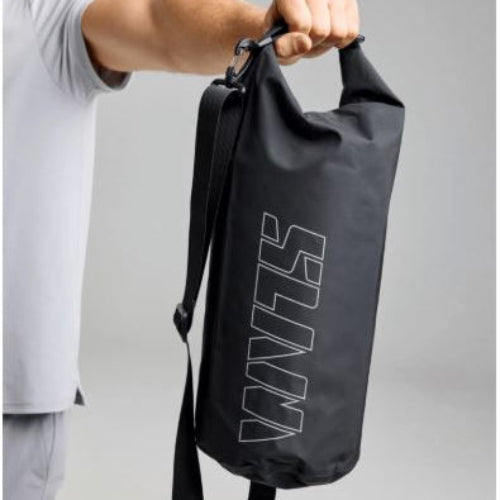 Person holding a black drawstring bag with 'SLaM' branding on a gray background