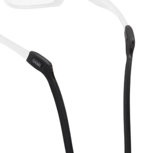 Close-up of black eyeglass frames with a white background