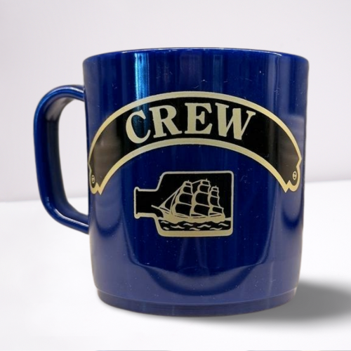 Royal Blue unbreakable mug, featuring black and gold accents of the words crew and a ship in a bottle.