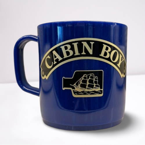 Royal Blue unbreakable mug, featuring black and gold accents of the words cabin boy and a ship in a bottle.