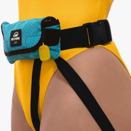Person wearing a yellow outfit with a blue fanny pack and black straps on a white background