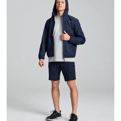 Reversible SLAM ACT Packlite Jacket with chest pocket that packs into itself for easy portability.