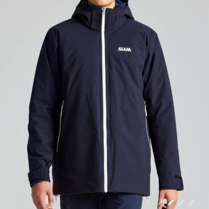 Person wearing a navy blue jacket with a brand logo on a gray background