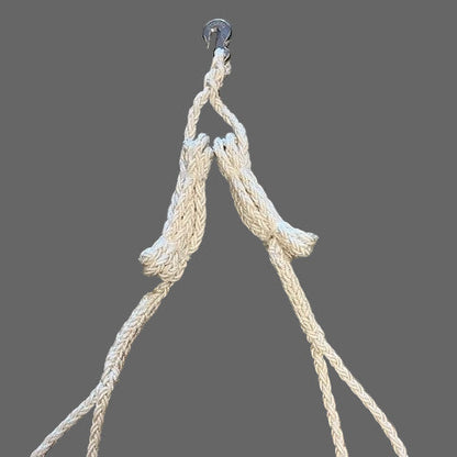 Beige rope with a hook on a gray background